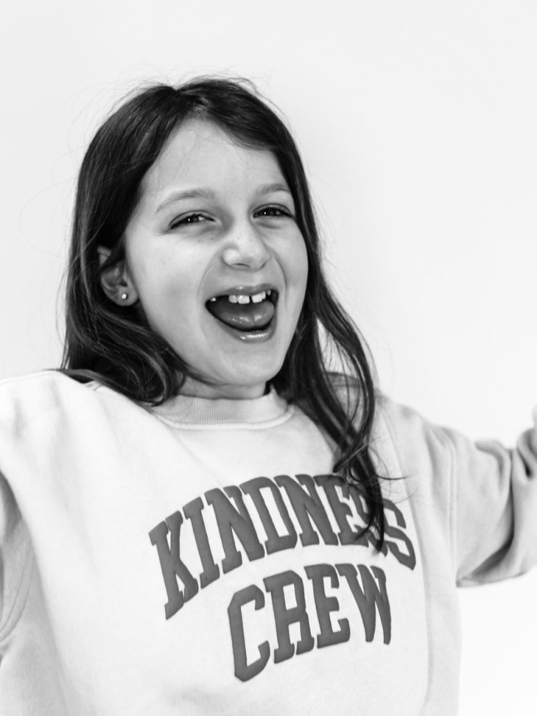 Black and white personality portrait of Buffalo child with authentic smile captured during individual photography session