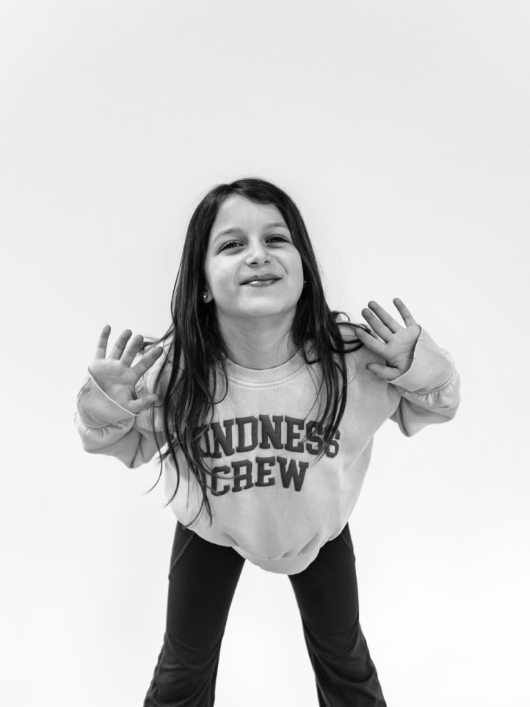 Black and white personality portrait of Buffalo child with authentic smile captured during individual photography session