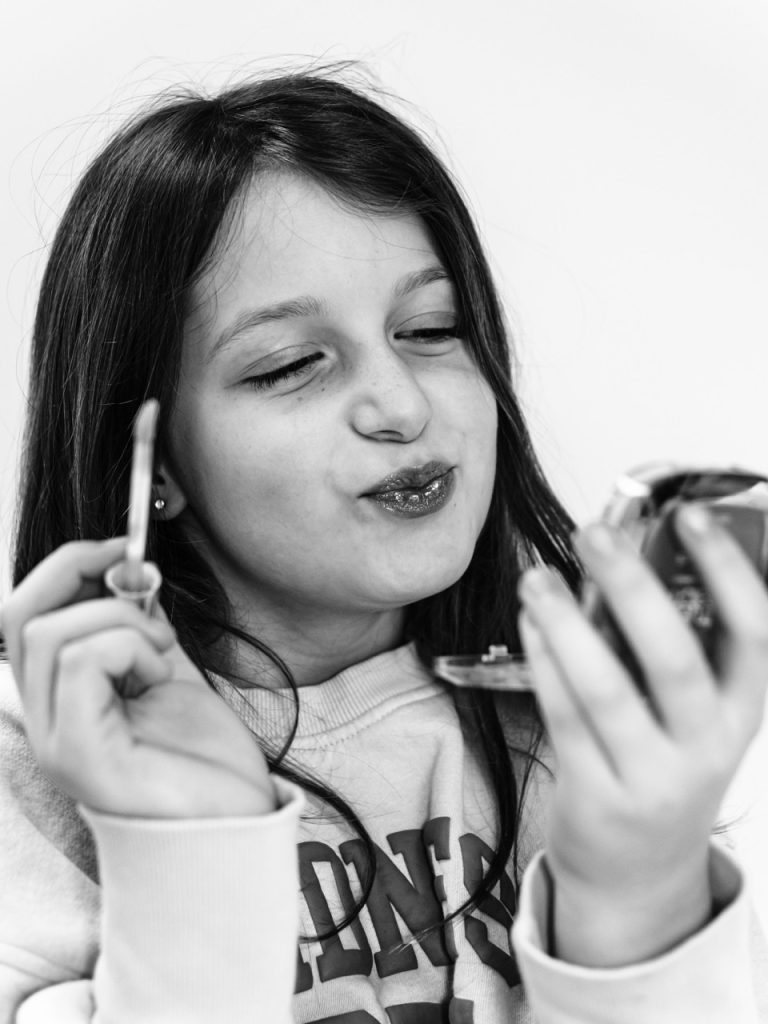 Black and white personality portrait of Buffalo child authentically being herself captured during individual photography session