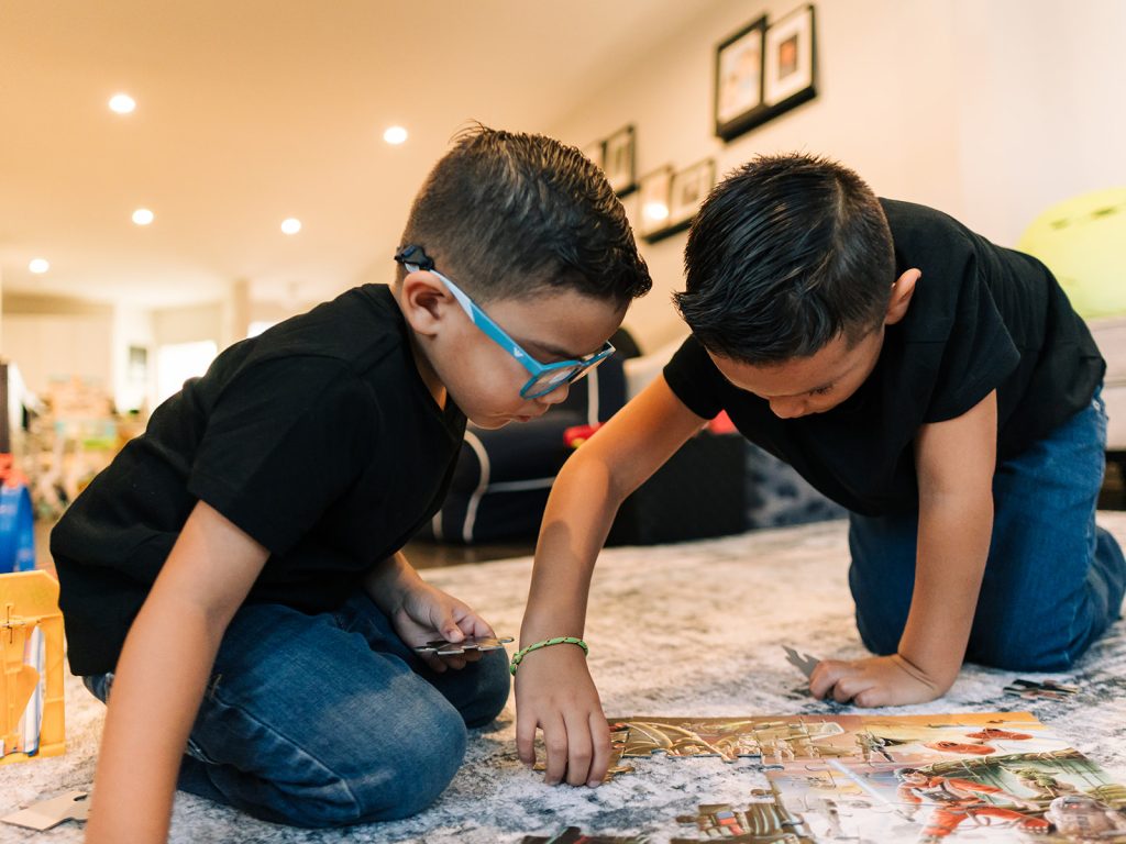 Documentary family session Buffalo in real lived-in home showing authentic moments not messy house family photos