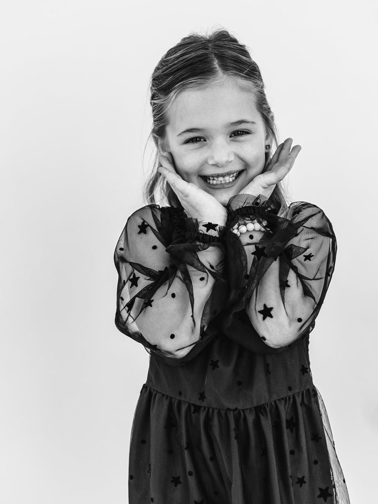 Young girl with authentic smile during personality portrait session in Grand Island