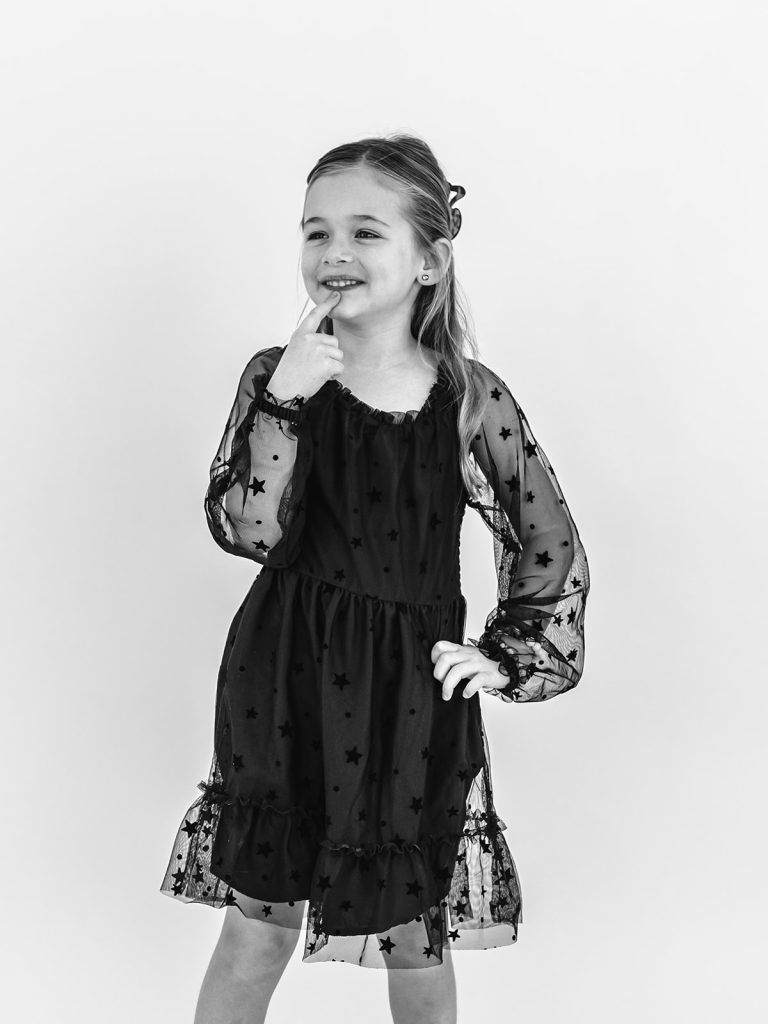 Young girl with authentic smile during personality portrait session in Grand Island