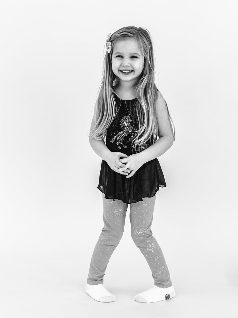 Young girl with authentic smile during personality portrait session in Grand Island