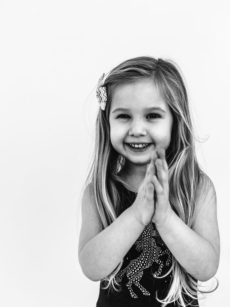 Young girl with authentic smile during personality portrait session in Grand Island