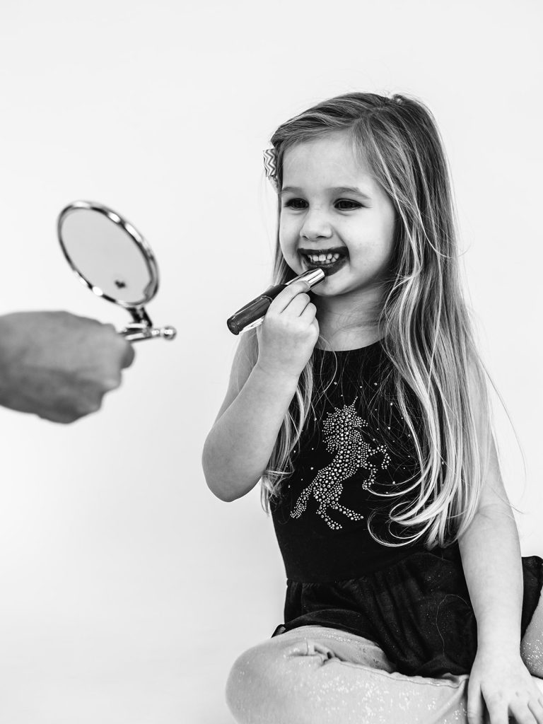 Young girl with authentic smile during personality portrait session in Grand Island
