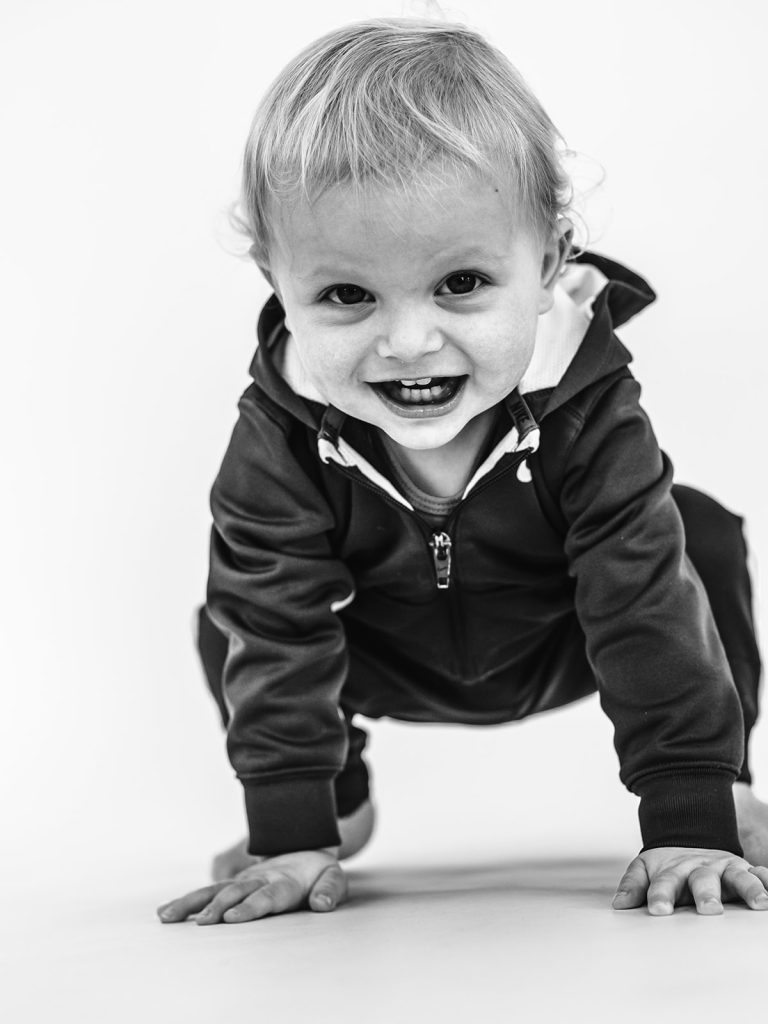 Boy showing genuine personality in black and white portrait by Buffalo photographer