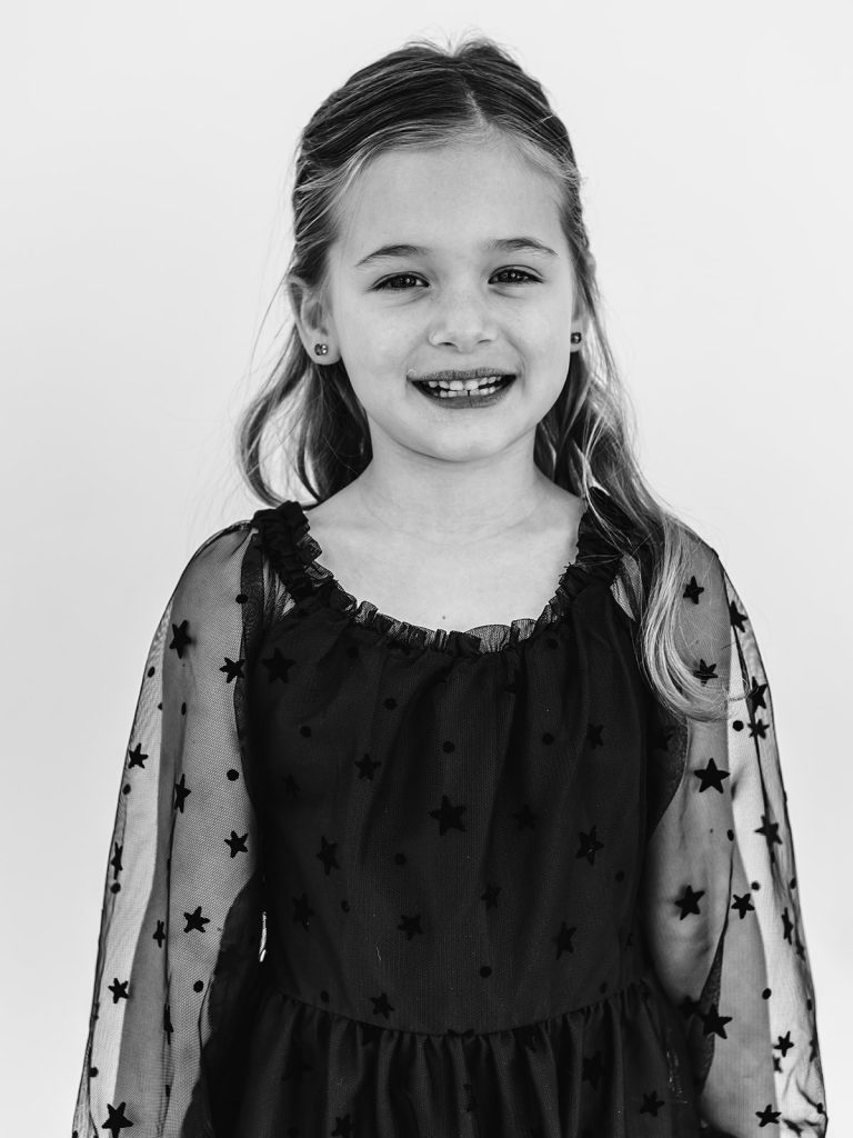Young girl with authentic smile during personality portrait session in Grand Island