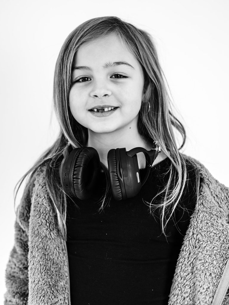 Thoughtful expression on child during individual personality portrait session