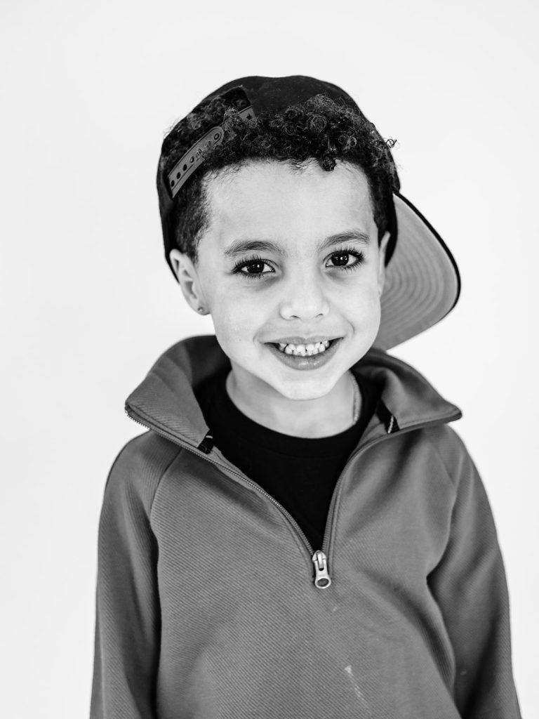 Thoughtful expression on child during individual personality portrait session