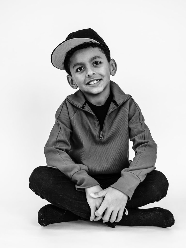 Thoughtful expression on child during individual personality portrait session